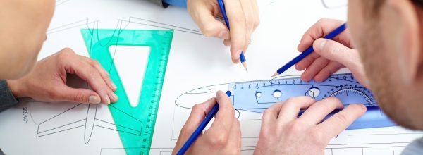 Close-up of a plane draft being made by engineers